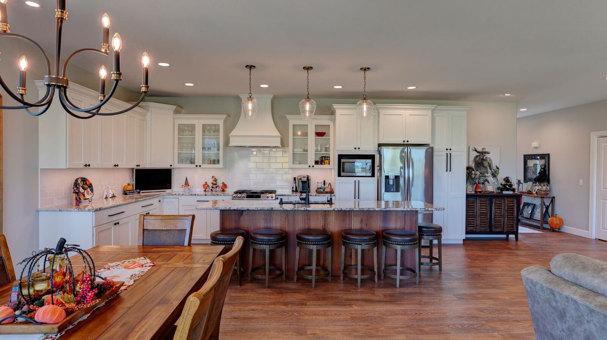 custom kitchen white backsplash tile and range hood